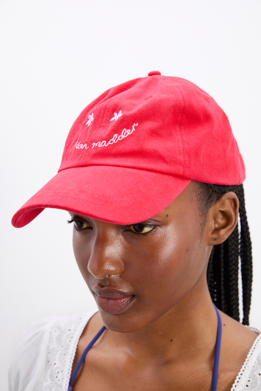 smiley cap in red with pink embroidery